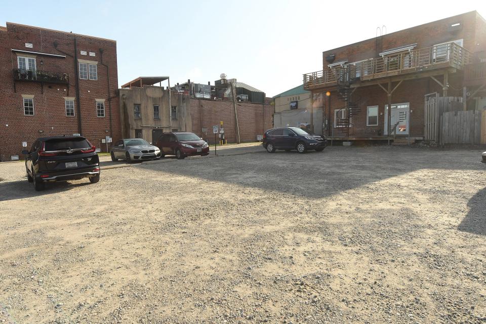 Parking area at 115 S Water Street Monday June 13,  2022 in downtown Wilmington, N.C. The Wilmington Historic Preservation Commission will consider plans for a 6-story mixed-use project along Water Street. The lot has seen several past development attempts. KEN BLEVINS/STARNEWS