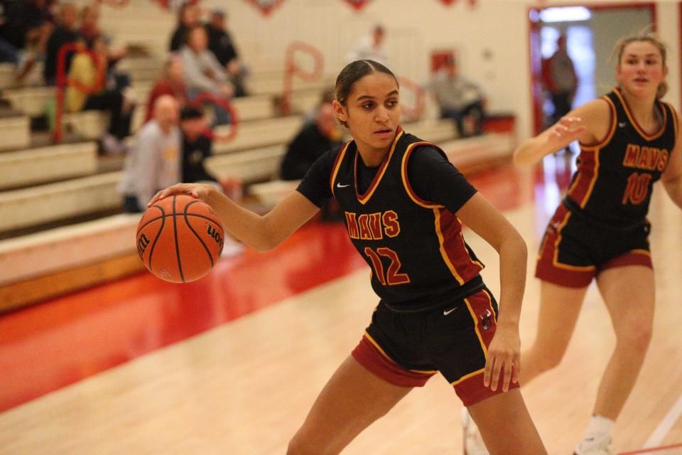 McCutcheon freshman Lillie Graves power dribbles against Chesterton during the Twin Lakes Holiday Tournament on Wednesday, Dec. 27, 2023.