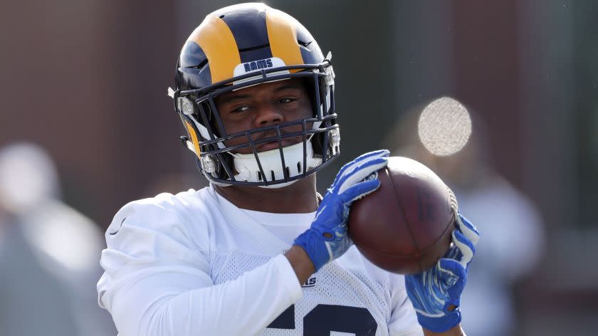 Los Angeles Rams linebacker Micah Kiser (59) catches a ball during practice for the NFL Super Bowl 53 football game against the New England Patriots, Friday, Feb. 1, 2019, in Flowery Branch, Ga. (AP Photo/John Bazemore)