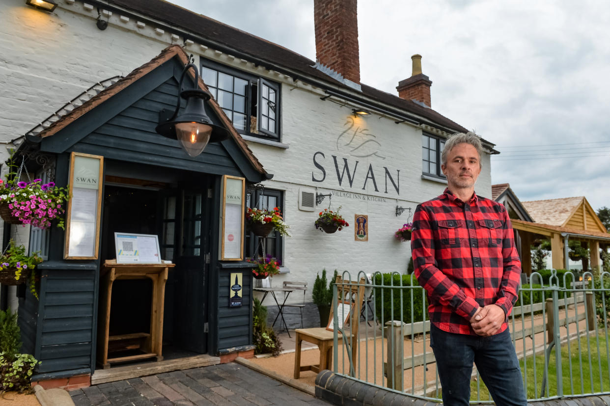 Landlord Barney Reynolds outside the Swan Inn, Hanley Swan, Worcester. (SWNS)