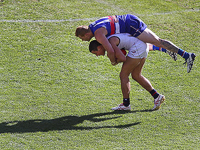  Adam Cooney gets on the back of Crow Rory Laird.