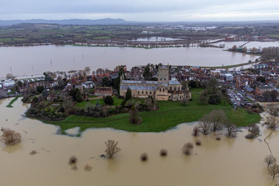 Flooding around Tewkesbury Abbey after heavy rain from Storm Gerrit (PA)