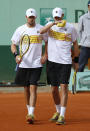 US Bob Bryan (down) and US Mike Bryan (R) hit a return to to Belarus Max Mirnyi and Canada's Daniel Nestor during Men's Doubles final tennis match of the French Open tennis tournament at the Roland Garros stadium, on June 9, 2012 in Paris. AFP PHOTO / THOMAS COEXTHOMAS COEX/AFP/GettyImages