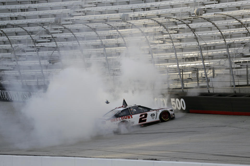 Brad Keselowski (2) does a burnout after winning after winning a NASCAR Cup Series auto race at Bristol Motor Speedway Saturday, May 30, 2020, in Bristol, Tenn. (AP Photo/Mark Humphrey)