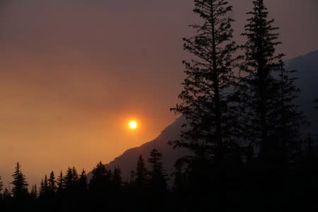 Smoke creates a red hazy sunset from the Swan Lake Fire on the Kenai Peninsula, in Seward, Alaska