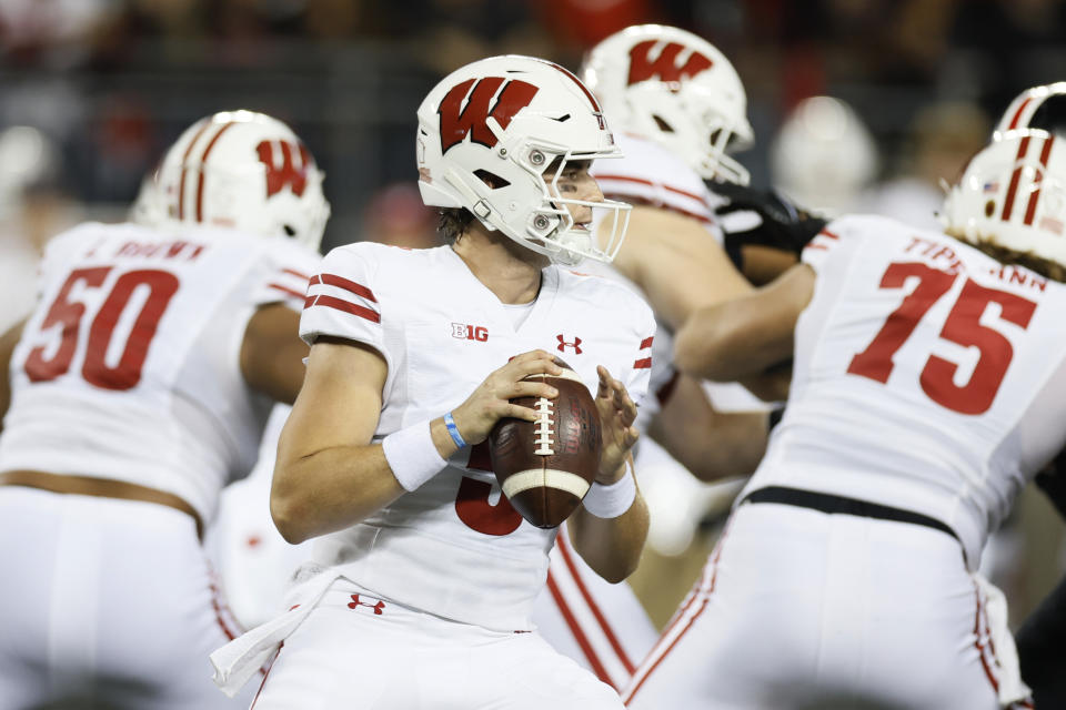 Wisconsin quarterback Graham Mertz drops back to pass against Ohio State during the first half of an NCAA college football game Saturday, Sept. 24, 2022, in Columbus, Ohio. (AP Photo/Jay LaPrete)