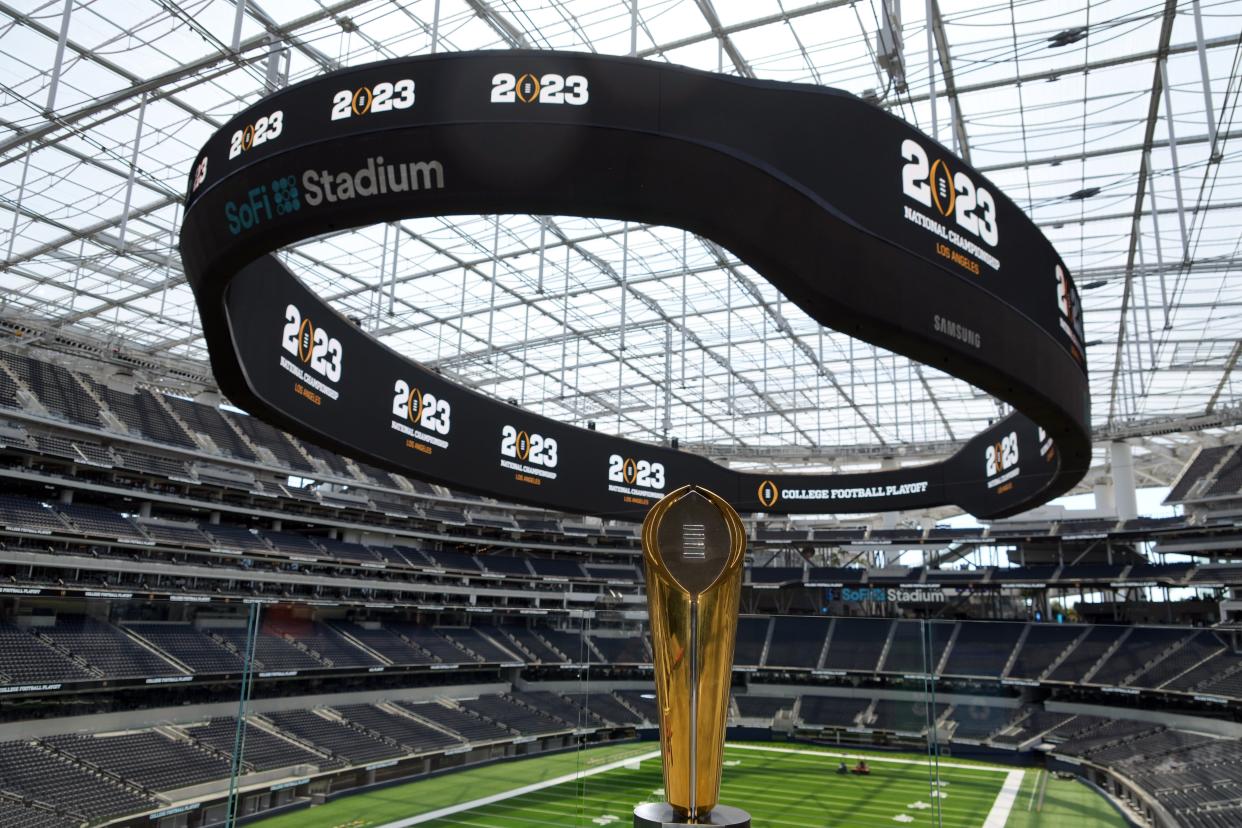 Apr 19, 2022; Inglewood, CA, USA; The College Football Playoff National Championship trophy on display during a 2023 CFP National Championship Kickoff press conference at SoFi Stadium. Mandatory Credit: Kirby Lee-USA TODAY Sports