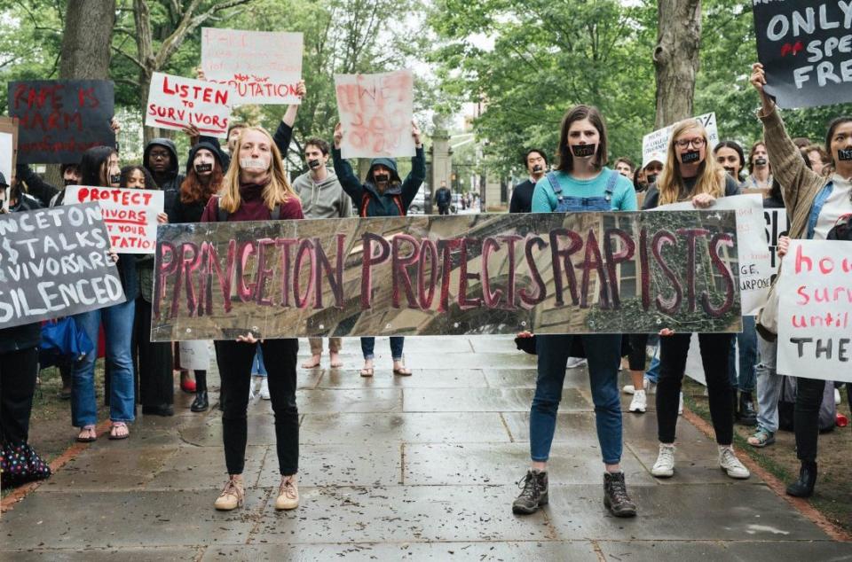 Student organizers staging a silent sit-in in front of Nassau Hall.&nbsp; (Photo: Elizabeth Yu)