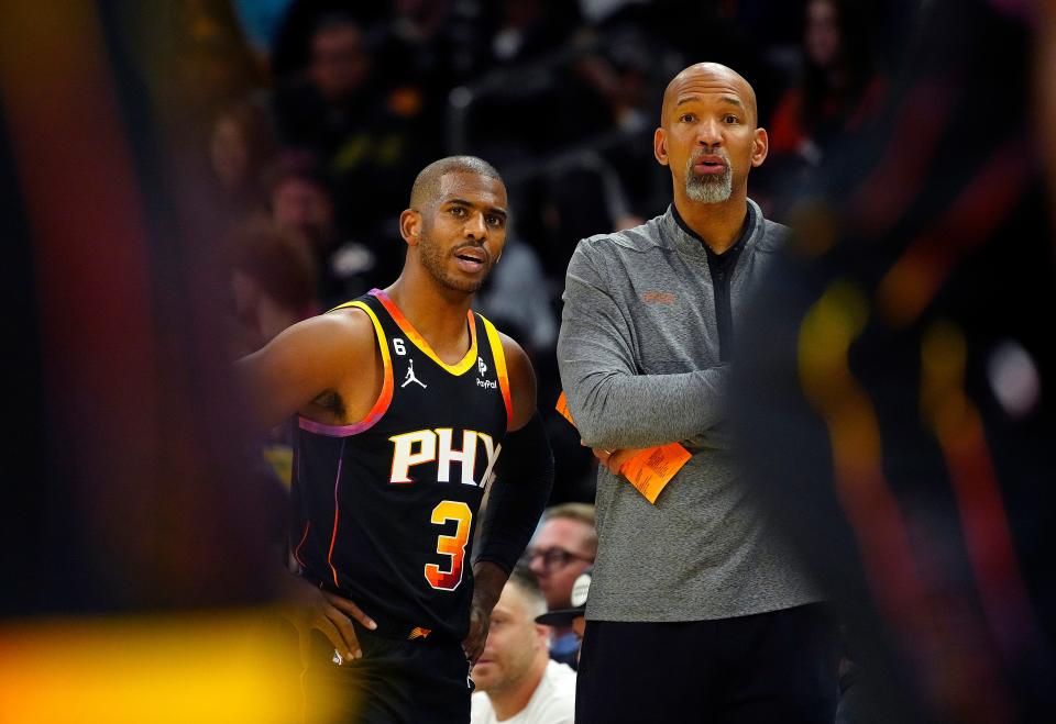 December 17, 2022; Phoenix, Ariz; USA; Suns head coach Monty Williams talks with guard Chris Paul (3) during the first half against the Pelicans at the Footprint Center. 