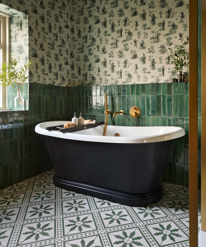 Green bathroom with green tiles, wallpaper, green bathtub