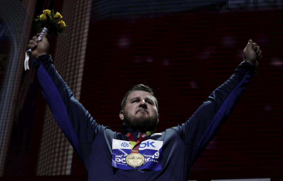 Joe Kovacs, of the United States, gold, during the medal ceremony for the men's shot put final at the World Athletics Championships in Doha, Qatar, Saturday, Oct. 5, 2019. (AP Photo/Nariman El-Mofty)