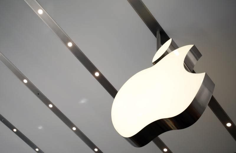 The Apple logo is pictured inside the newly opened Omotesando Apple store at a shopping district in Tokyo June 26, 2014. REUTERS/Yuya Shino/Files