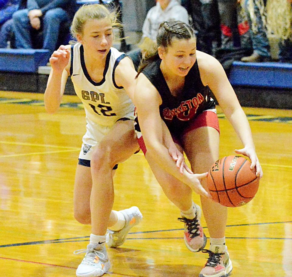 Sisseton's Hannah Leverson snaps a loose ball in front of Great Plains Lutheran's Abby Kjenstad during their season-opening high school girls basketball game on Thursday, Dec. 1, 2022 in Watertown. Sisseton won.