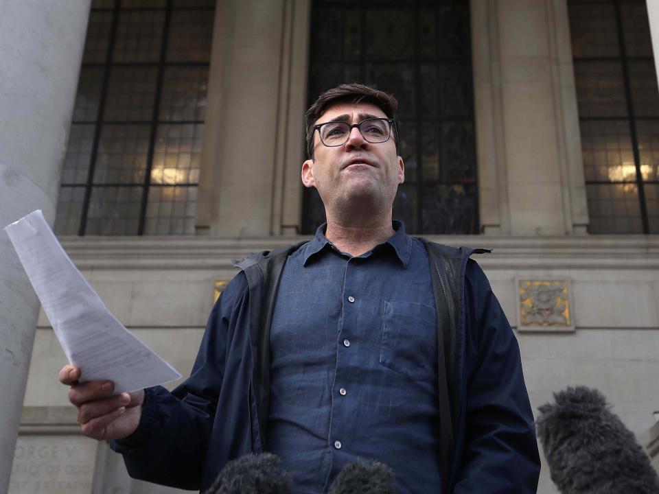 Greater Manchester mayor Andy Burnham speaking to the media outside the Central Library in Manchester, he has threatened legal action if Tier 3 restrictions are imposed without agreement (PA)