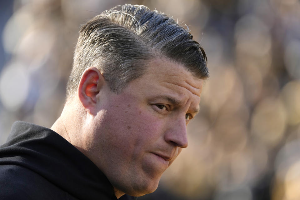 Iowa offensive coordinator Brian Ferentz stands on the field before an NCAA college football game against Illinois, Saturday, Nov. 18, 2023, in Iowa City, Iowa. (AP Photo/Charlie Neibergall)