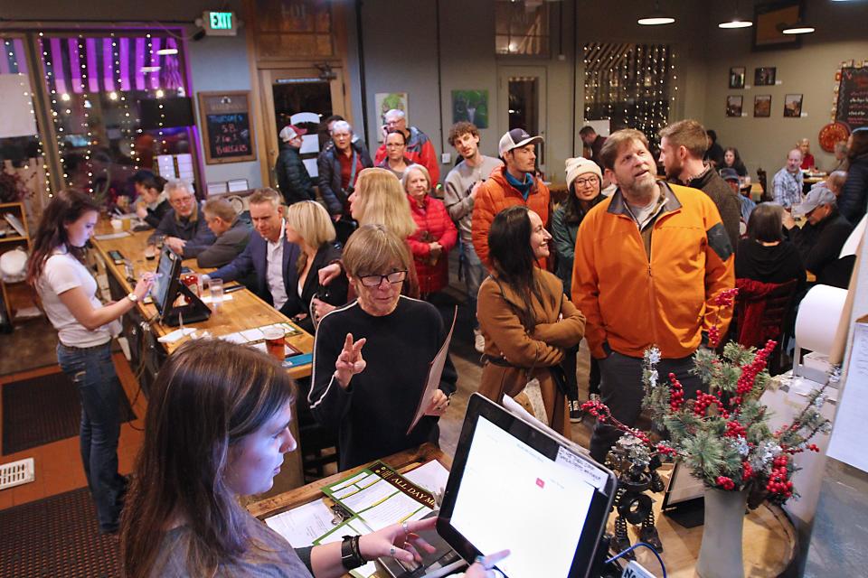 Patrons wait in line to order during Choice City’s 2-for-1 burger night Feb. 8 in Fort Collins.