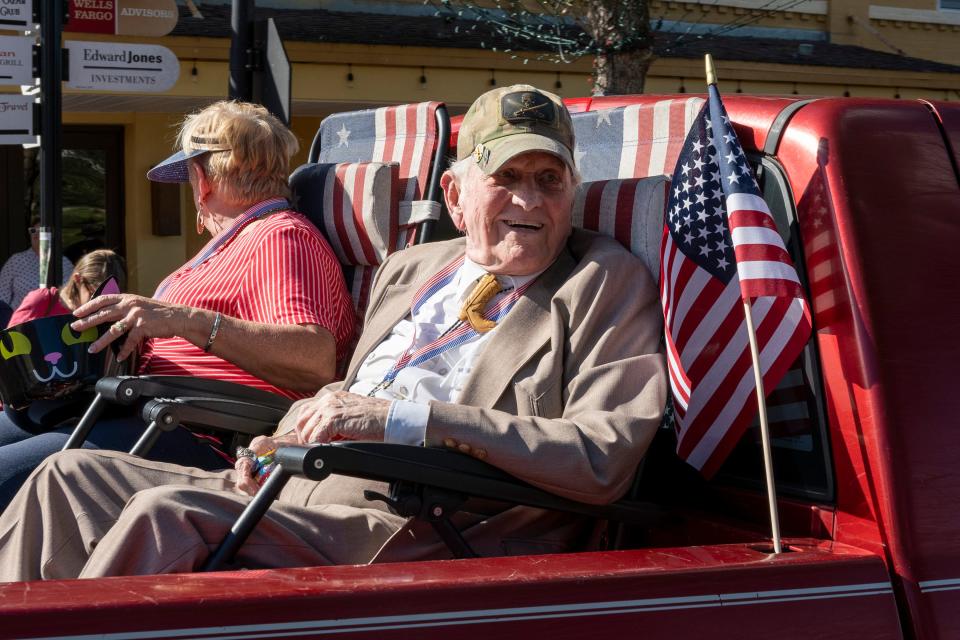 John “Papa John” McCrary rides on the back of the Combat Cafe truck at the third annual Lake County VetFest Parade in 2021.