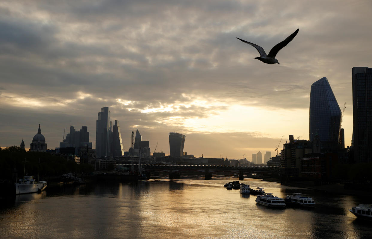 The city of London financial district is seen over the Thames