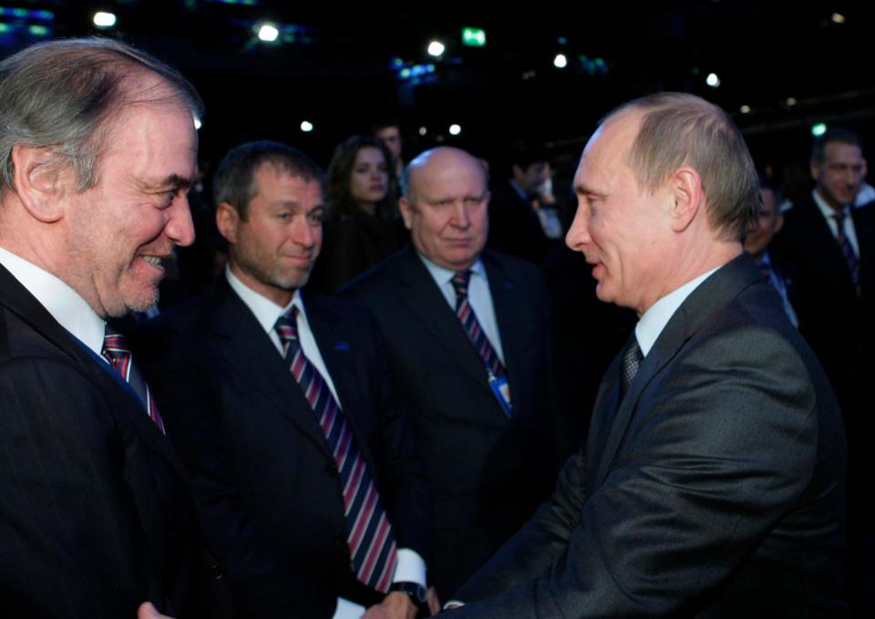 Russian leader Vladimir Putin congratulates members of a Russian delegation, from left, Valery Gergiyev, businessman Roman Abramovich and Nizhny Novgorod Gov. Valery Shantsev, on Russia being selected to host the 2018 soccer World Cup.