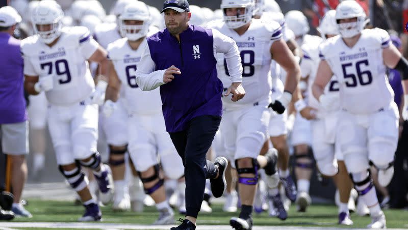 Northwestern coach David Braun takes the field to face Rutgers Sunday, Sept. 3, 2023, in Piscataway, N.J. On Saturday, Braun will lead his charges onto the field Allegiant Stadium to face the Utes in the Las Vegas Bowl.
