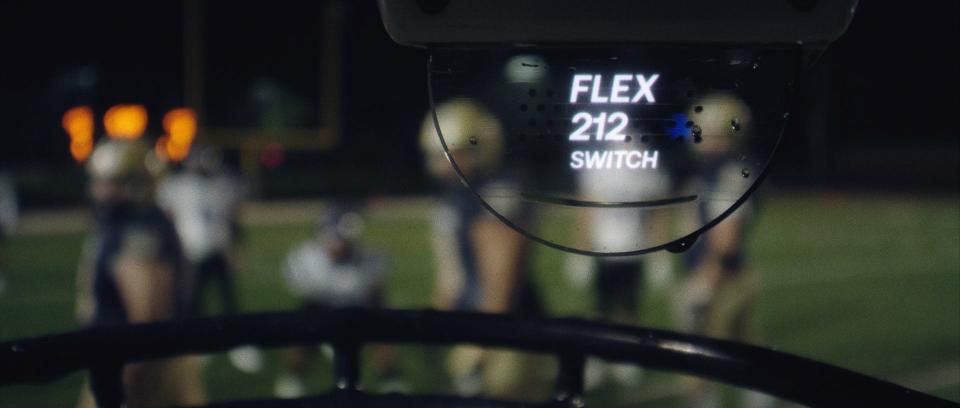 The lens of the 5G connected helmet developed by AT&T and Gallaudet shows the play call sent from a coach using a tablet.