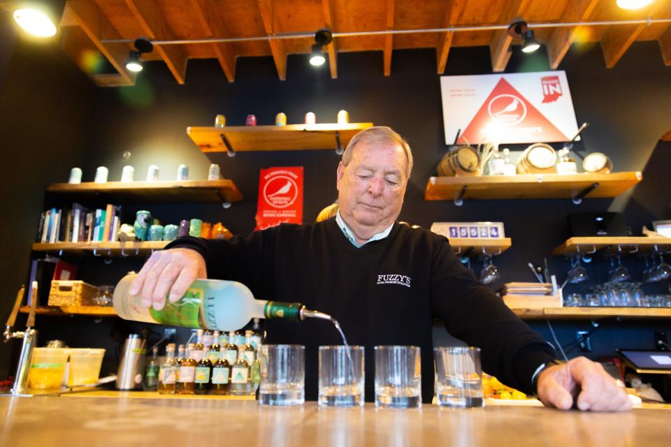 Fuzzy Zoeller pours Fuzzy’s Vodka on Nov. 20, 2019, at Cardinal Spirits, the Bloomington craft distillery that is now producing and bottling the vodka.