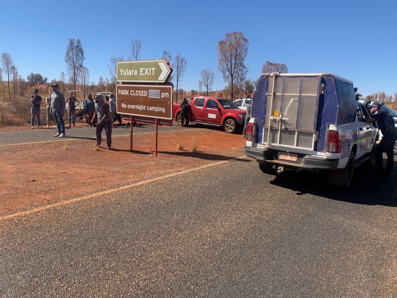 People block entry to Uluru-Kata Tjuta National Park to visitors from coronavirus hotspots, in Uluru-Kata Tjuta National Park