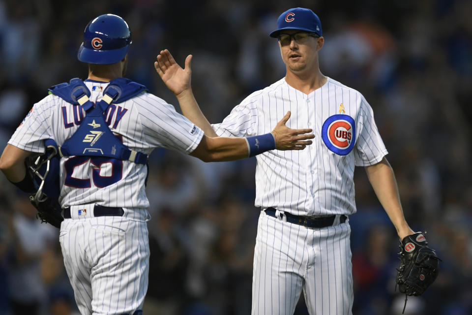 Chicago Cubs closing pitcher Alec Mills right, celebrates with catcher Jonathan Lucroy (25) after defeating the Pittsburgh Pirates in a baseball game Friday, Sept. 13, 2019, in Chicago. (AP Photo/Paul Beaty)