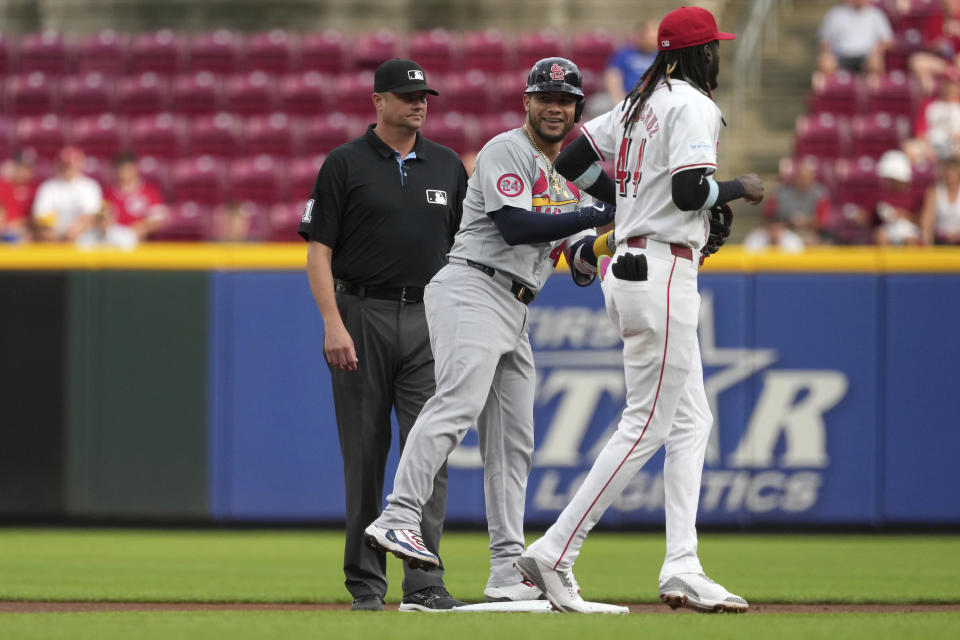 St. Louis Cardinals' Willson Contreras smiles toward the dugout after hitting a double during the first inning of a baseball game against the Cincinnati Reds, Tuesday, Aug. 13, 2024, in Cincinnati. (AP Photo/Kareem Elgazzar)