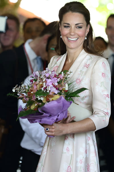 Catherine, Duchess of Cambridge smiles as she leaves Singapore Botanical Gardens on day 1 during her Diamond Jubilee tour on September 11, 2012 in Singapore. Prince William, Duke of Cambridge and Catherine, Duchess of Cambridge are on a Diamond Jubilee Tour of the Far East taking in Singapore, Malaysia, the Solomon Islands and the tiny Pacific Island of Tuvalu. (Photo by Suhaimi Abdullah/WireImage)