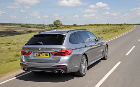 2017 BMW 5-series Touring driving, rear 