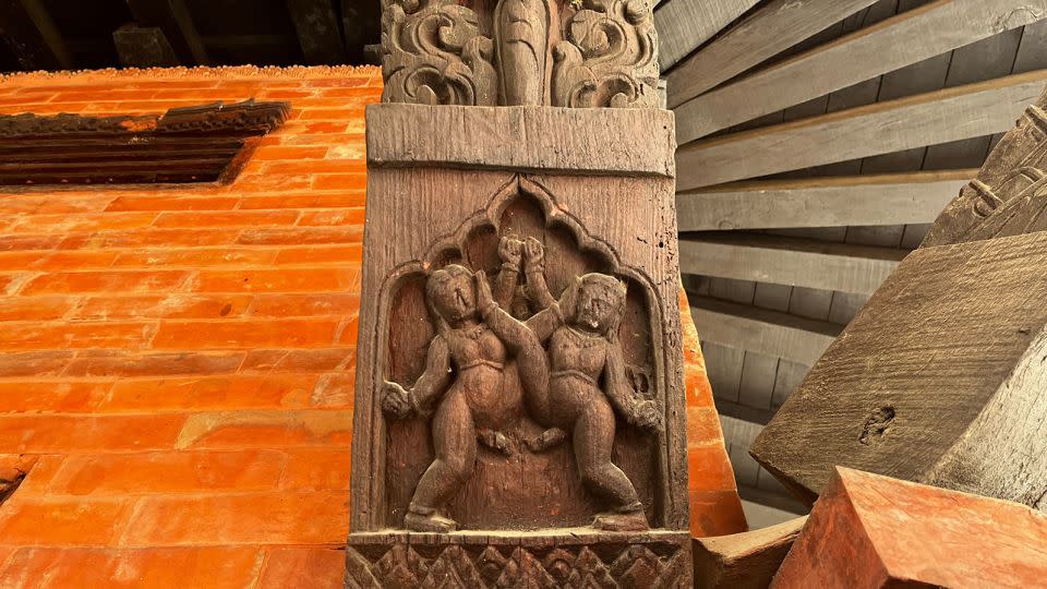 Two male figures engage in a sexual act in this carving at a Kathmandu temple - Bibek Bhandari