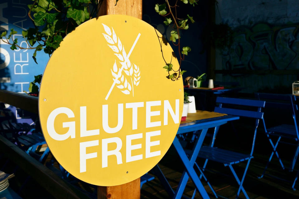 A "Gluten Free" sign displayed at an outdoor dining area
