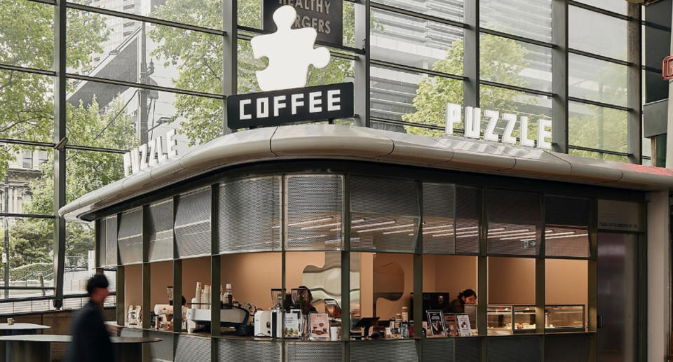 The outside of Puzzle Coffee in Southern Cross Station in Melbourne can be seen. 