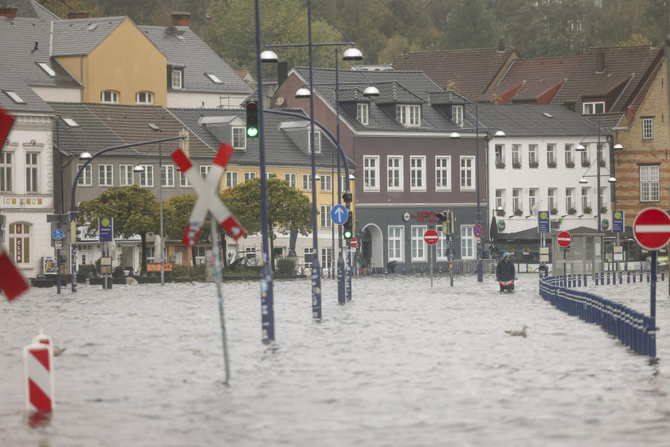 Water flooded a street in the city center in Flensburg, Germany, Friday, Oct. 20, 2023. A powerful storm pushes the Baltic Sea water ashore and causes flooding in Schleswig-Holstein. In Flensburg, it could be the highest storm surge in 100 years. (Frank Molter/dpa via AP)