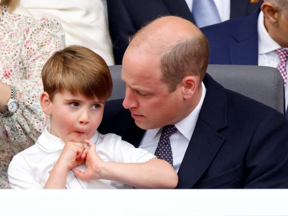 Prince William holds Prince Louis on his lap