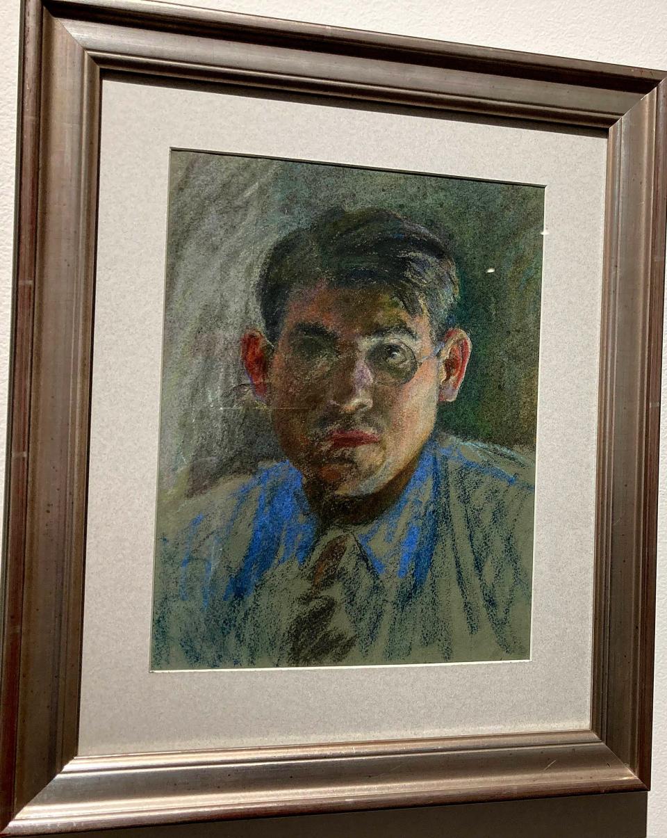 One of the few self-portraits of Erie painter Joseph Plavcan hangs near the stairwell that leads to the Erie Art Museum exhibit "Joseph Plavcan: The Making of an Artist." The museum said Plavcan is believed to have painted the portrait in the 1940s, when he was in his 30s or early 40s. Plavcan, who died at 72 in 1981, rarely dated his work, the museum said.