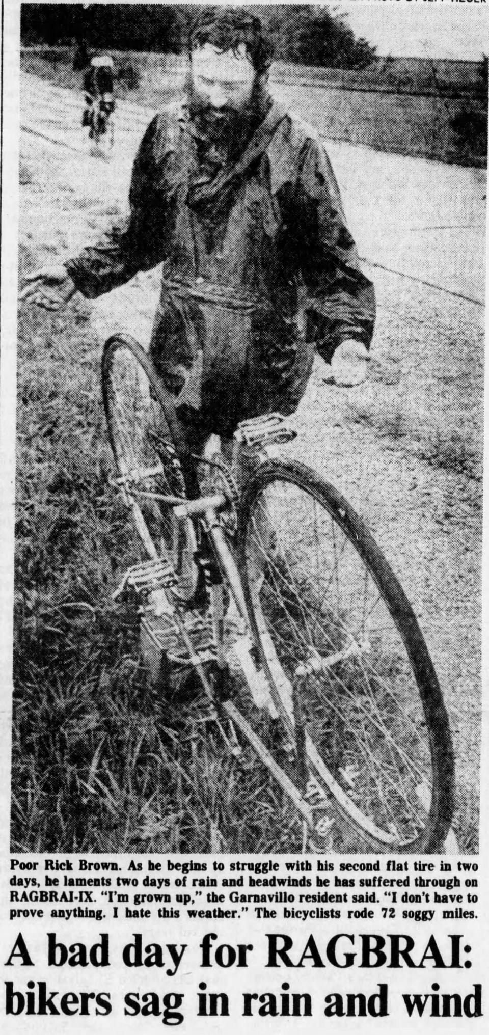 Rick Brown struggles with his second flat tire on "Soggy Monday," on July 27, 1981. Temperatures never rose above 50 degrees and riders were hit by rain and stiff headwinds.