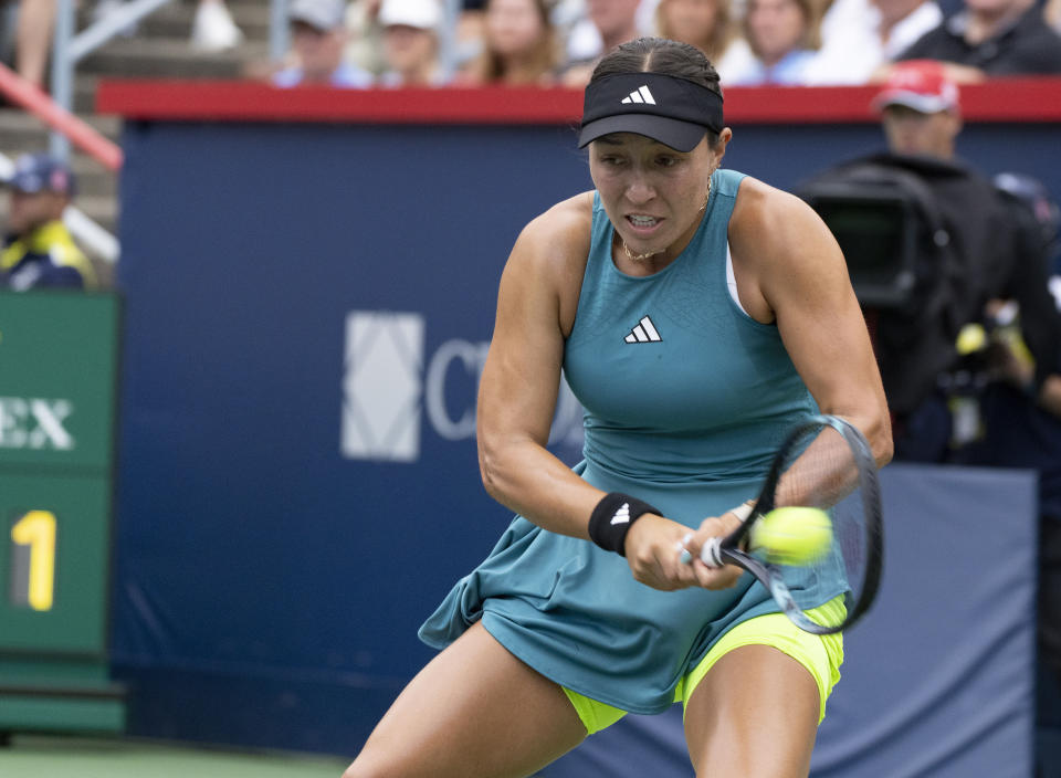 Jessica Pegula, of the United States, hits a return to Liudmila Samsonova, of Russia, in the women's final of the National Bank Open tennis tournament in Montreal, Sunday, Aug. 13, 2023. (Christinne Muschi/The Canadian Press via AP)