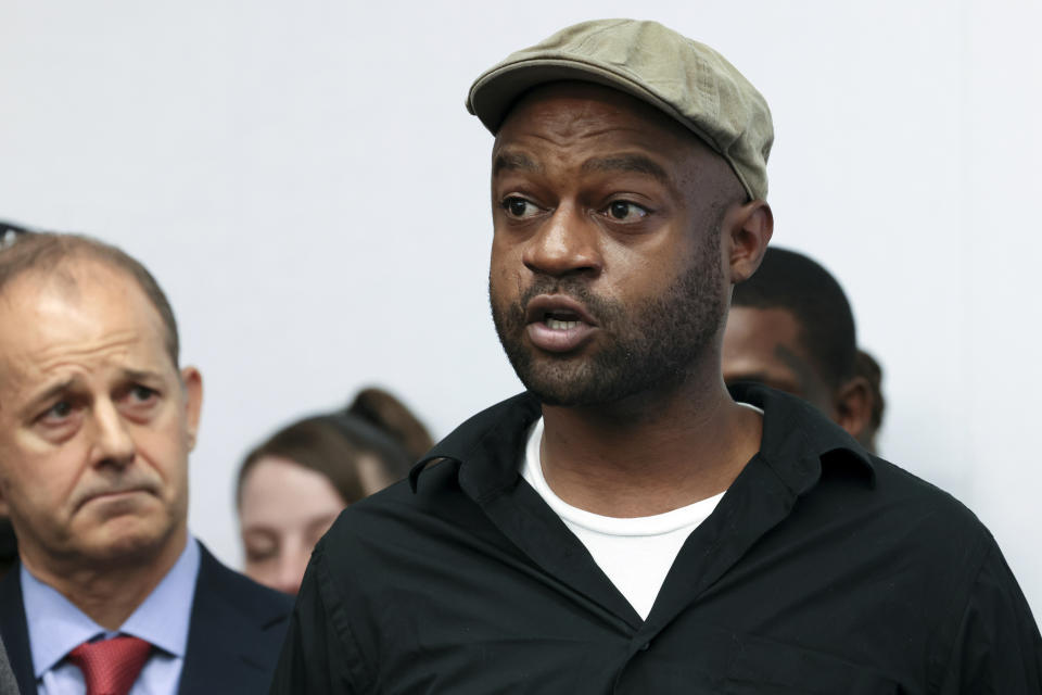 Jeffery Christian, right, speaks at a press conference in Chicago, Tuesday, May 7, 2024. Christian, along with two others, claim they were sexually abused as children while incarcerated at Illinois juvenile detention centers, stepped forward Tuesday as part of a lawsuit recounting decades of disturbing allegations of systemic child abuse. (AP Photo/Teresa Crawford)