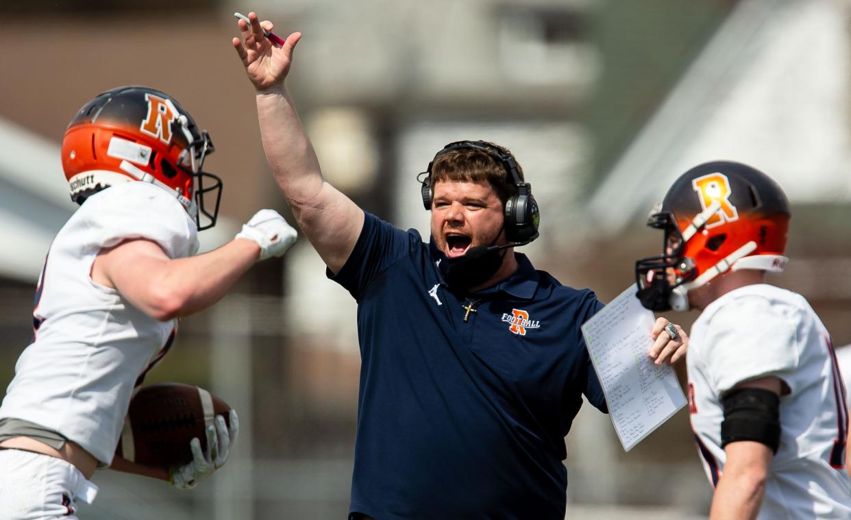 Rochester head football coach Derek Leonard celebrates a kickoff recovered by the Rockets against Springfield in the first half at Memorial Stadium in Springfield, Ill., Saturday, March 27, 2021. [Justin L. Fowler/The State Journal-Register] 