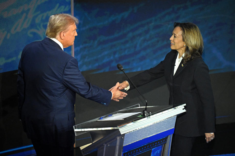 TOPSHOT - US Vice President and Democratic presidential candidate Kamala Harris (R) shakes hands with former US President and Republican presidential candidate Donald Trump during a presidential debate at the National Constitution Center in Philadelphia, Pennsylvania, on September 10, 2024. (Photo by SAUL LOEB / AFP) (Photo by SAUL LOEB/AFP via Getty Images)