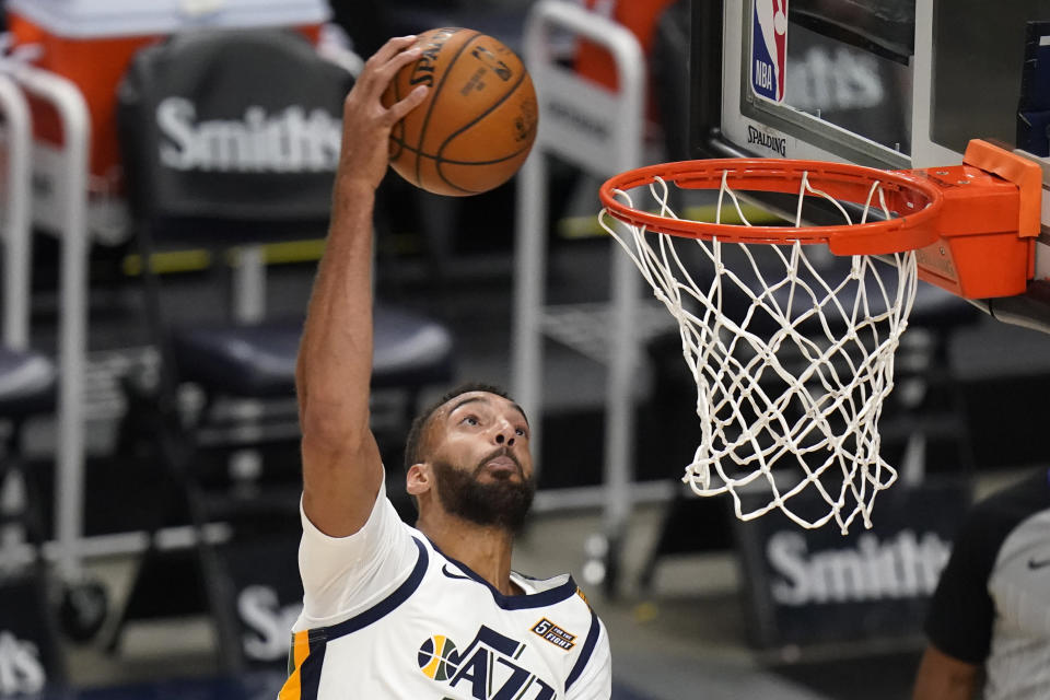 Utah Jazz center Rudy Gobert goes to the basket against the Houston Rockets during the second half of an NBA basketball game Saturday, May 8, 2021, in Salt Lake City. (AP Photo/Rick Bowmer)