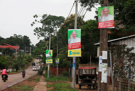 Posters of Pope Francis hang on lamp posts along a street in Puerto Maldonado, ahead of the papal's visit to Peru, January 18, 2018. REUTERS/Henry Romero