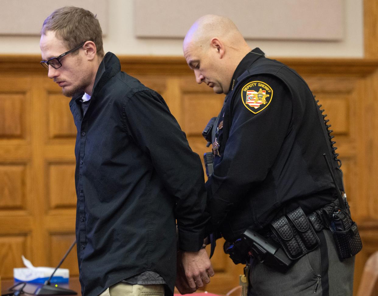 A Stark County Sheriff's Office deputy handcuffs Tyler Scullion after Common Pleas Judge Natalie Haupt sentenced him Monday for aggravated vehicular homicide.