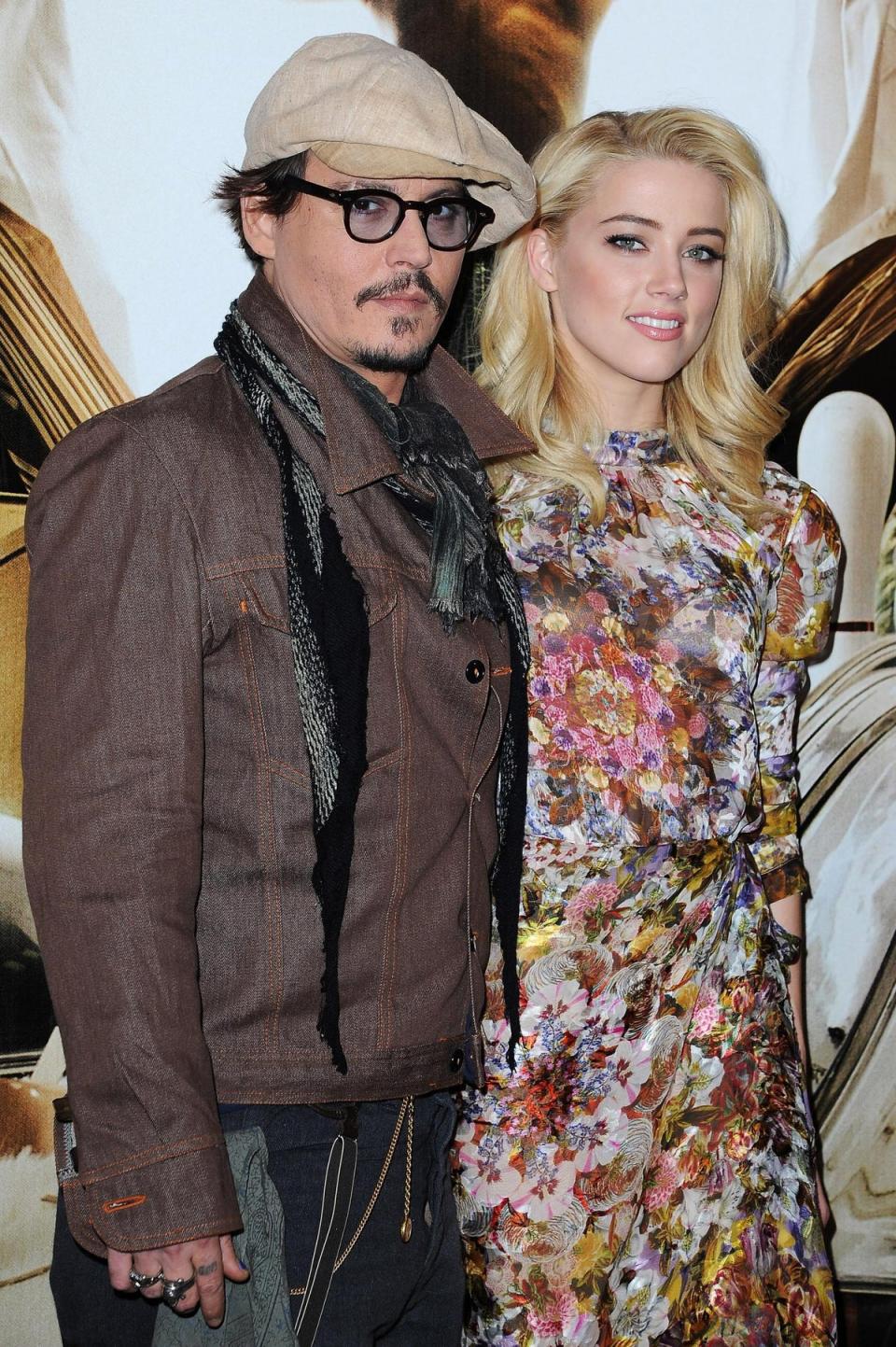 November 8, 2011 <br><br>Johnny Depp and Amber Heard pose on the red carpet for the <i>Rhum Express</i> photocall in Paris, France (Getty Images)