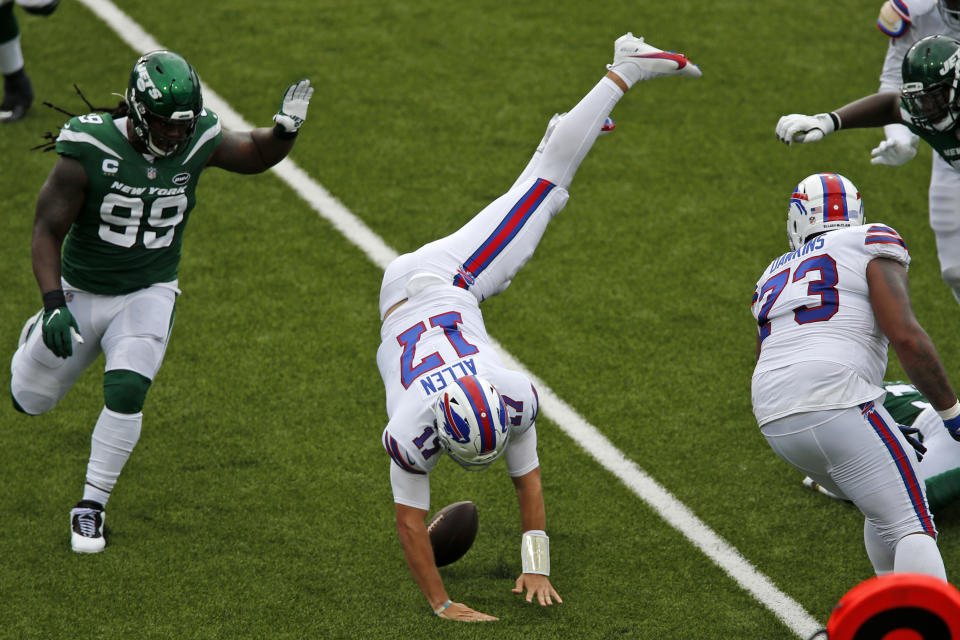 Buffalo Bills quarterback Josh Allen (17) is upended during the first half of an NFL football game against the New York Jets in Orchard Park, N.Y., Sunday, Sept. 13, 2020. (AP Photo/John Munson)