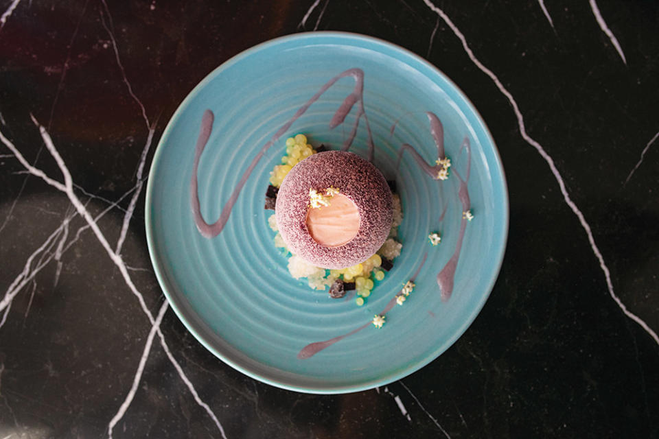 W Hotel’s Cassis Plum dessert, a bombe with elderflower yogurt foam, choya granita and yuzu pearls.