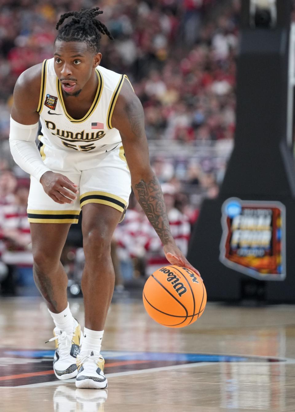 Purdue Boilermakers guard Lance Jones (55) dribbles the ball during the NCAA Men’s Basketball Tournament Final Four game against the North Carolina State Wolfpack, Saturday, April 6, 2024, at State Farm Stadium in Glendale, Ariz.