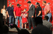 Gwen Matthews, 10, hugs her older brother's jersey, Atlanta Falcons first-round draft pick Jake Matthews, during an NFL news conference at the team's headquarters Friday, May 9, 2014, in Flowery Branch, Ga. Matthews, an offensive lineman from Texas A&M, was the selected 6th overall in Thursday's NFL draft. (AP Photo/Jason Getz)